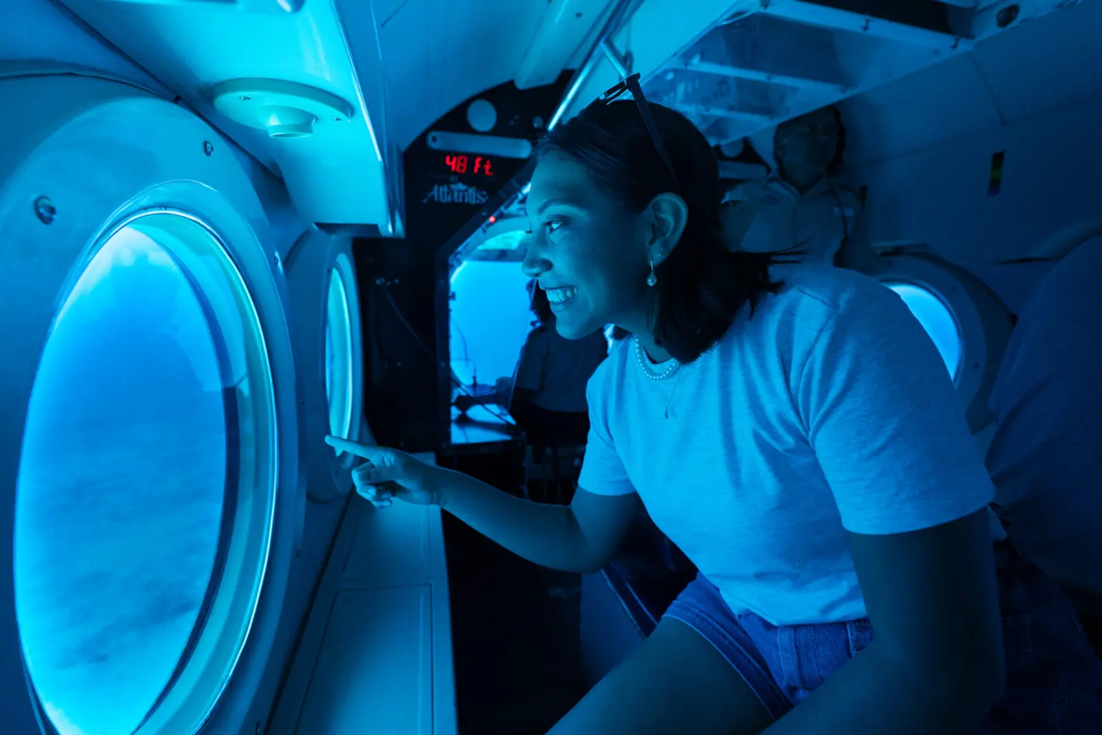 Board the submarine Climb down into your seat with viewing window