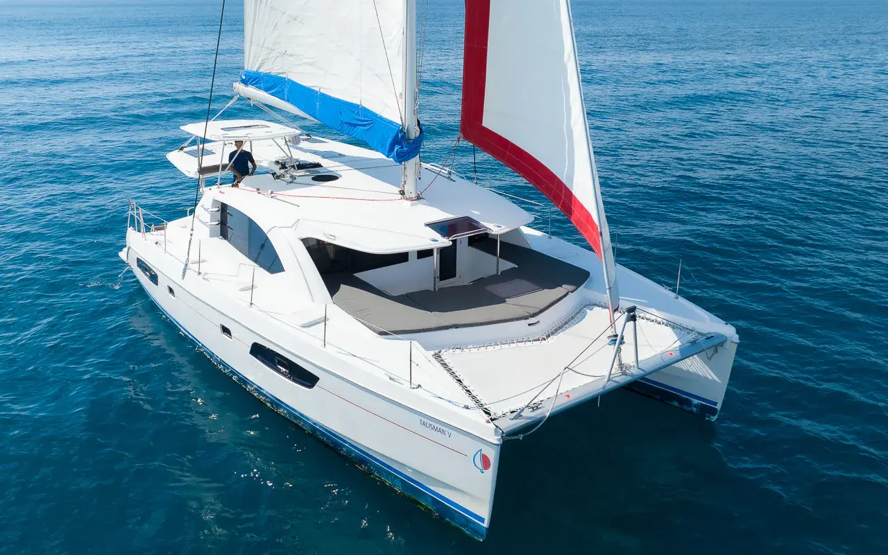 Return to Puerto Aventuras Cruise back with open bar and shaded lounging on multiple deck areas