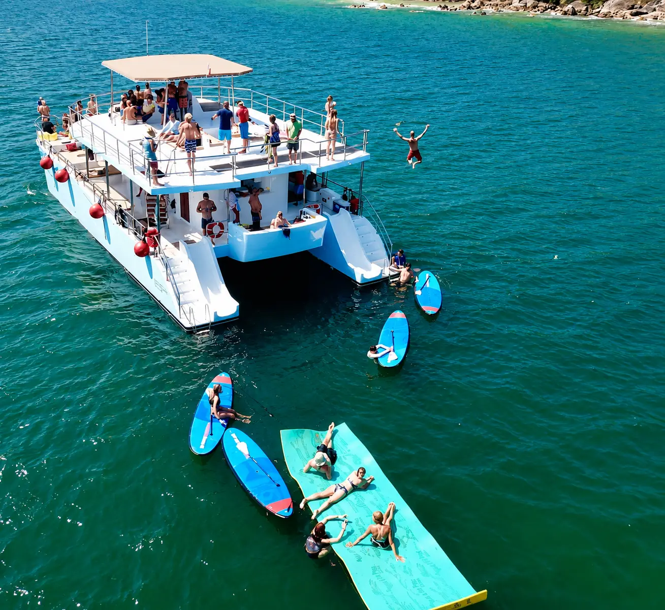 Beach Stop & All The Toys Drop anchor at a nice beach and let out everything on board: slides, dive platform, paddleboards, kayaks and snorkel gear