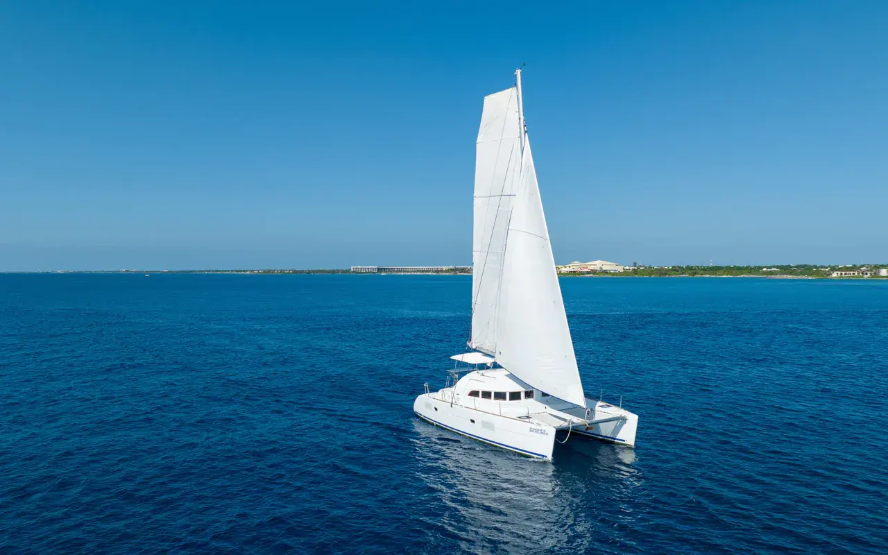 Cruise the Riviera Maya Coast Wide catamaran cruises with a smooth, stable ride, Bluetooth music playing